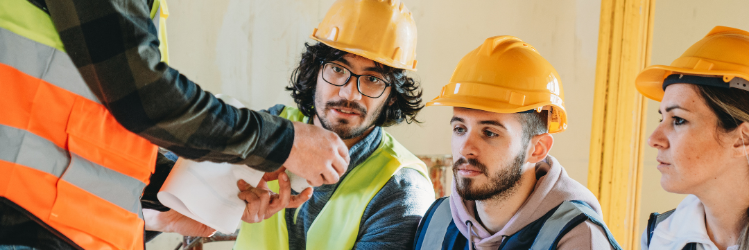construction workers at site discussing